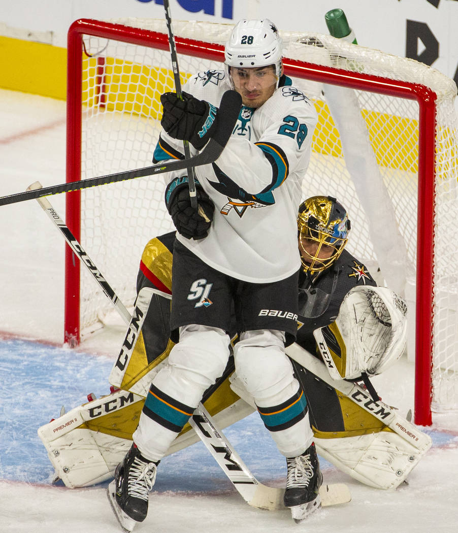 San Jose Sharks right wing Timo Meier (28) backs into Vegas Golden Knights goaltender Marc-Andr ...