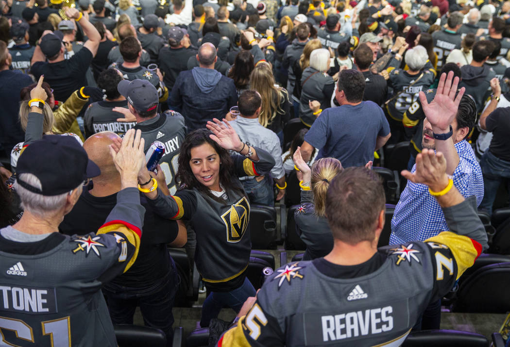 Vegas Golden Knights fans celebrate another goal over the San Jose Sharks during the third peri ...