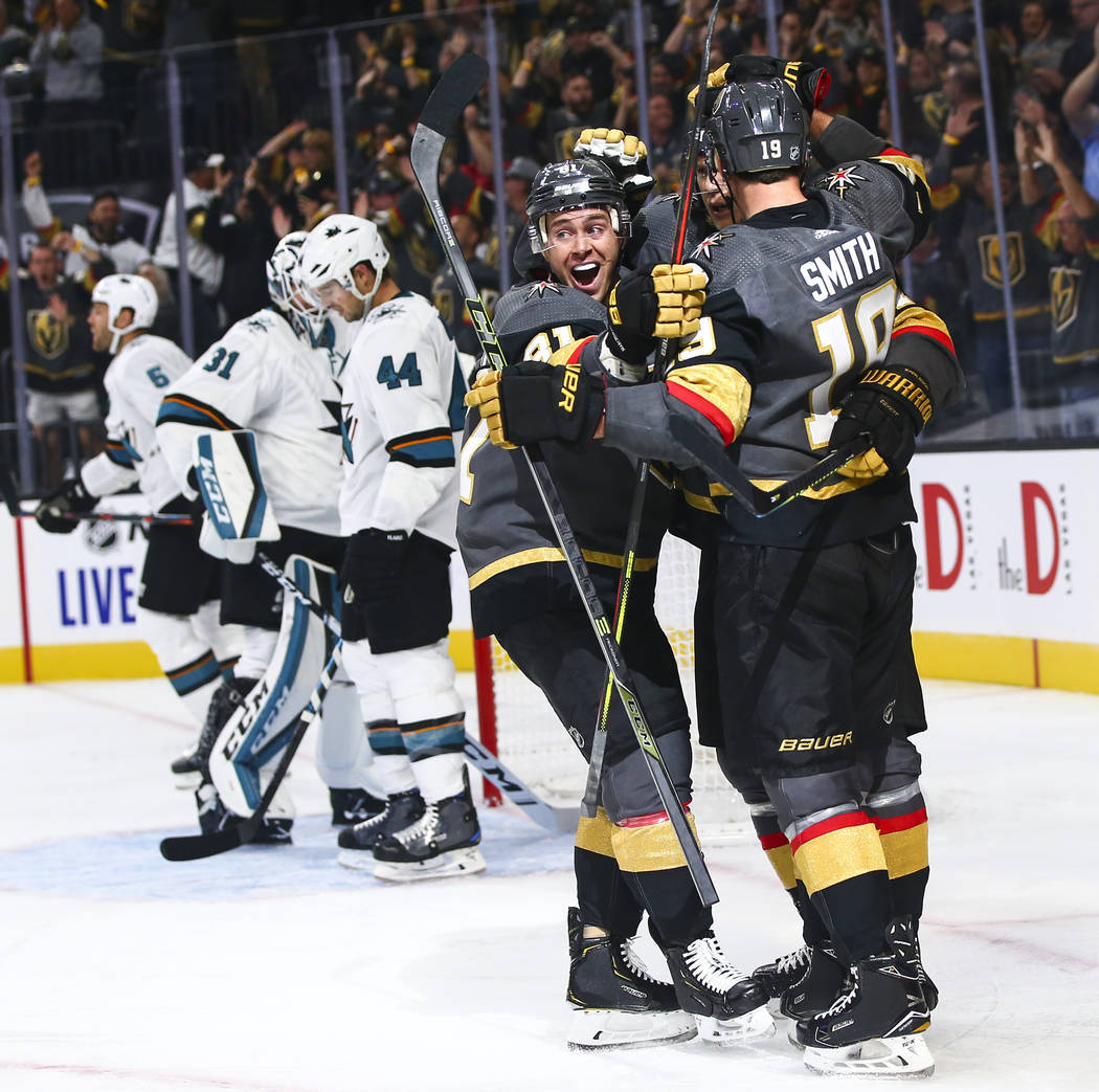 Golden Knights' Jonathan Marchessault, left, celebrates a goal by Reilly Smith (19) during the ...