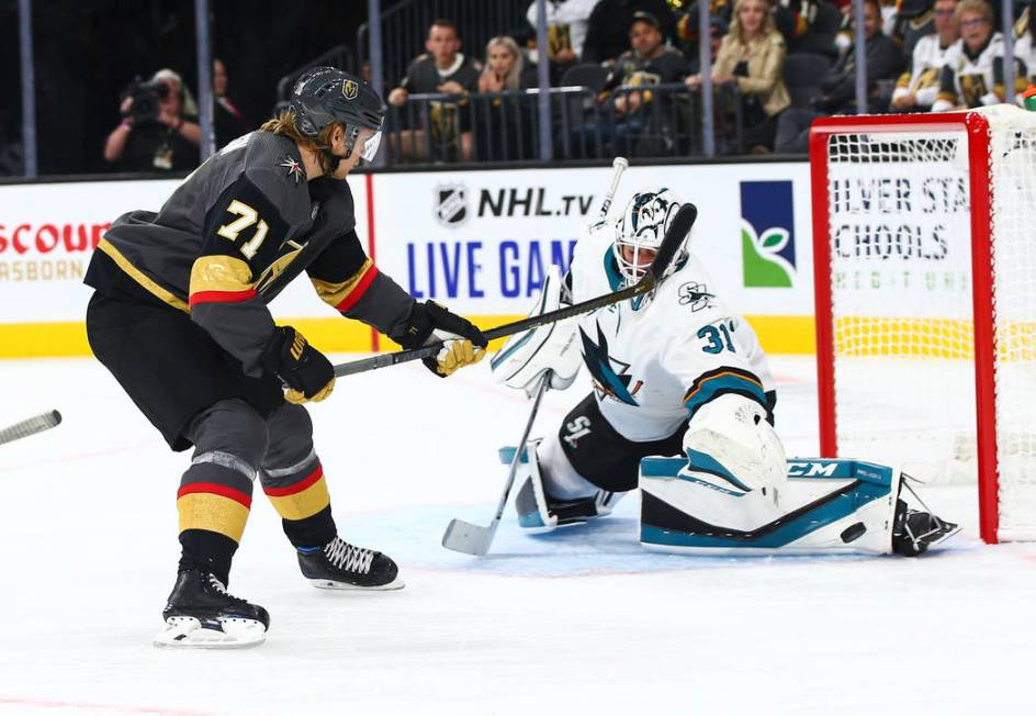 San Jose Sharks goaltender Martin Jones (31) blocks a shot from Golden Knights' William Karlsso ...