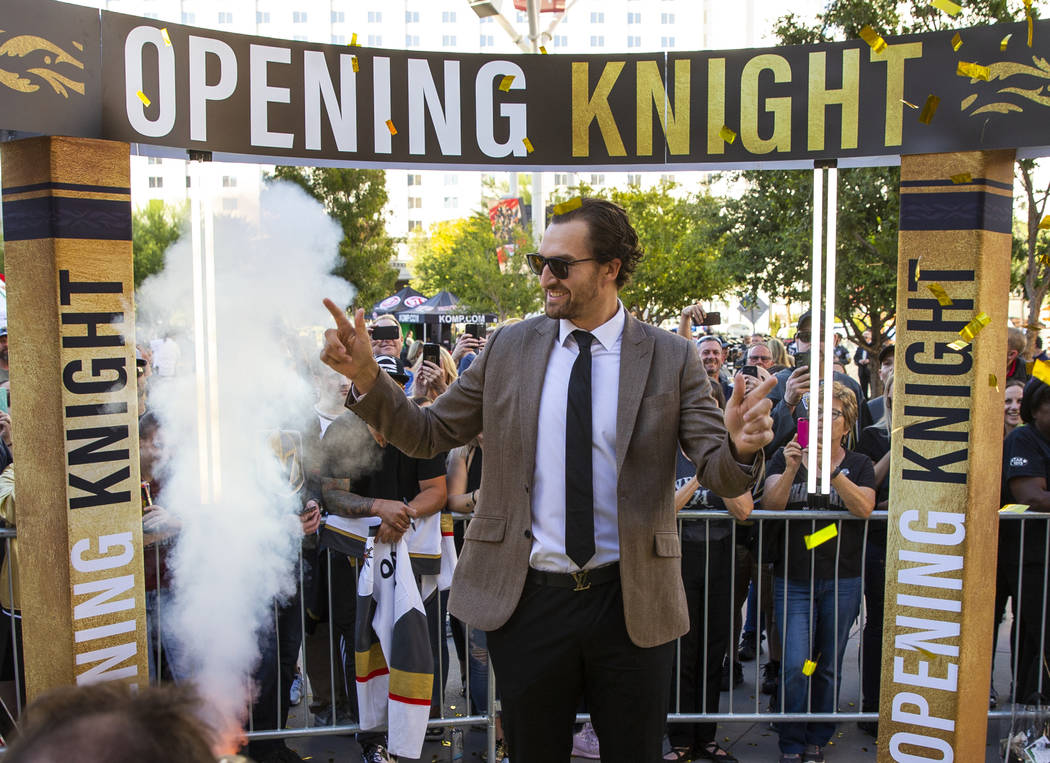 Vegas Golden Knights right wing Mark Stone strikes a pose about smoke and fans while walking th ...