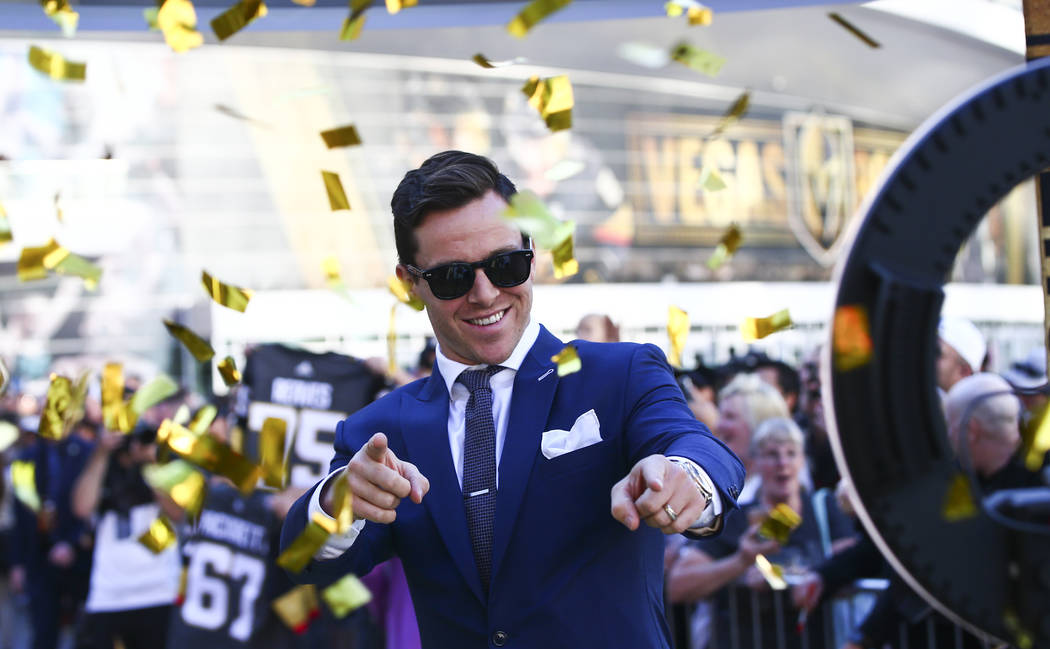 Golden Knights' Jonathan Marchessault poses for a picture on the gold carpet after arriving for ...