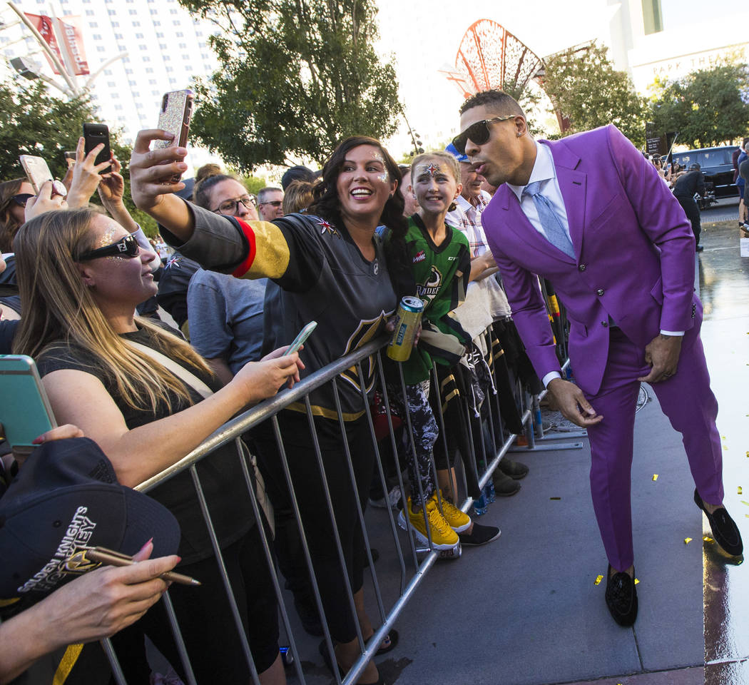 Golden Knights' Ryan Reaves poses for a photo with fans on the gold carpet after arriving for t ...