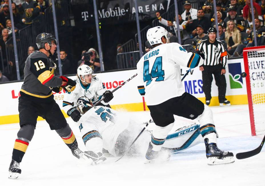 Golden Knights' Reilly Smith (19) sends the puck past San Jose Sharks goaltender Martin Jones ( ...