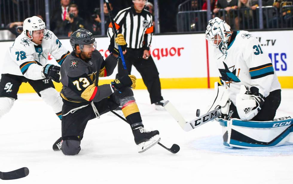 San Jose Sharks goaltender Martin Jones (31) blocks a shot from Golden Knights' Brandon Pirri ( ...