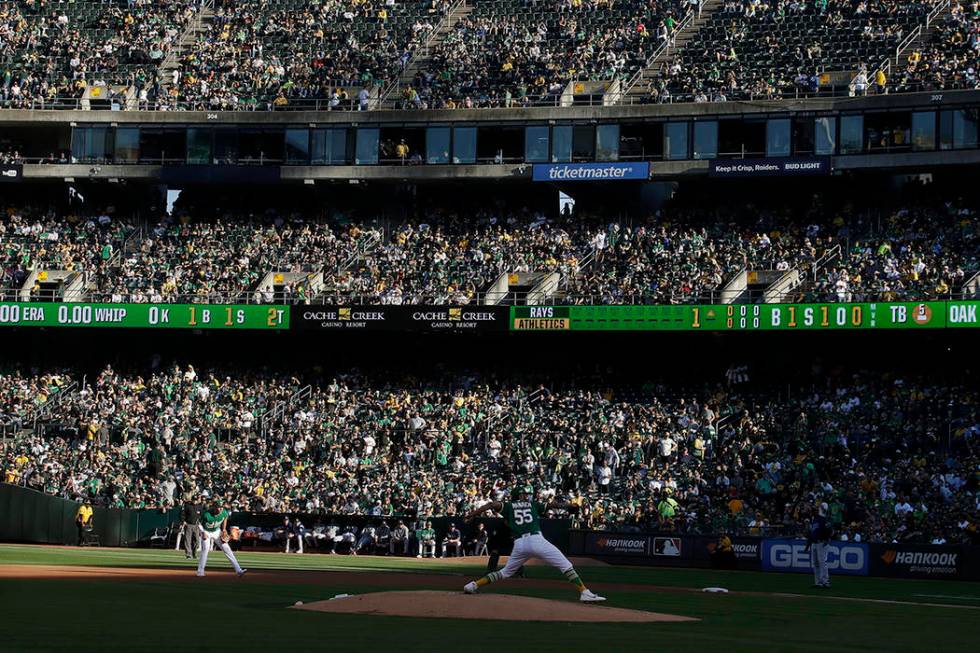 Fans at RingCentral Coliseum watch as Oakland Athletics pitcher Sean Manaea (55) throws to a Ta ...