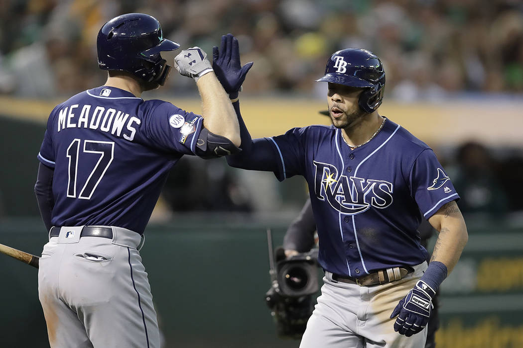 Tampa Bay Rays' Tommy Pham, right, is congratulated by Austin Meadows after hitting a solo home ...