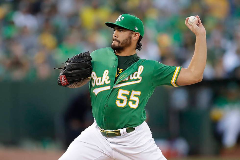 Oakland Athletics pitcher Sean Manaea (55) throws to a Tampa Bay Rays batter during the first i ...