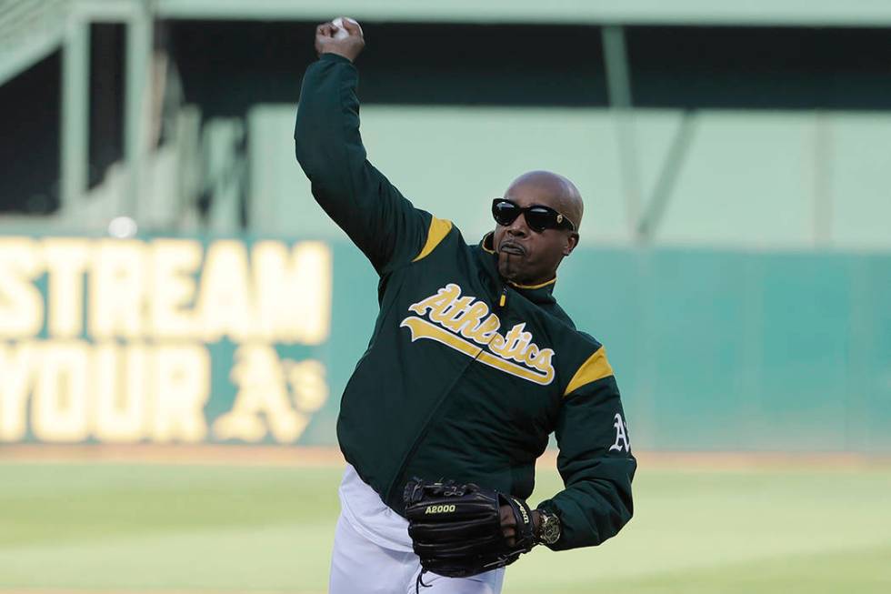 Musician M.C. Hammer throws out the ceremonial first pitch before an American League wild-card ...