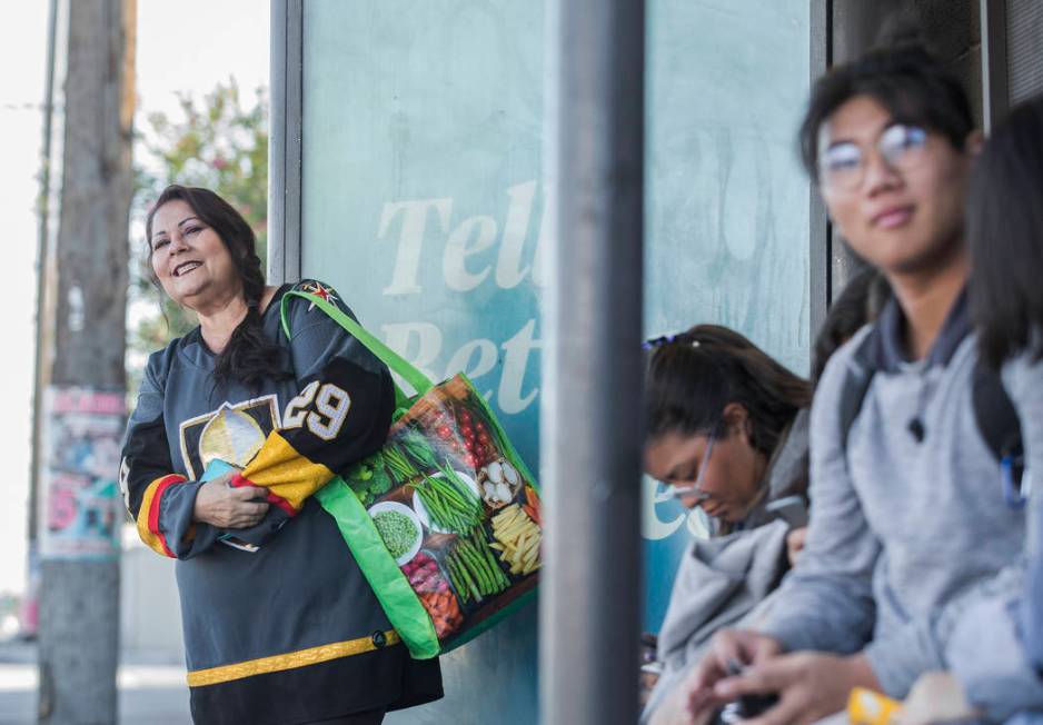 Elena Leger, left, waits for an RTC bus to take her to Toshiba Plaza to watch the Vegas Golden ...