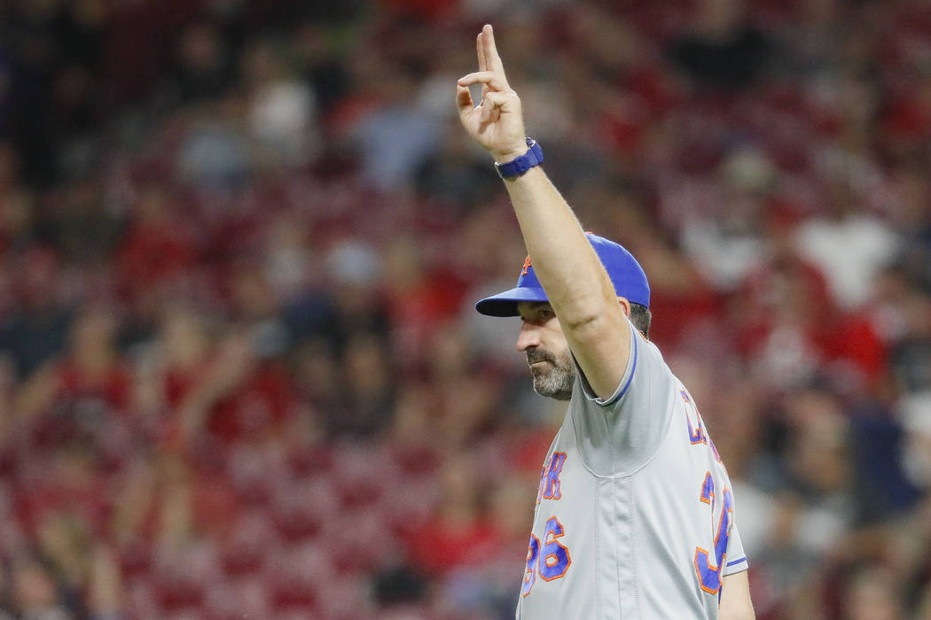 New York Mets manager Mickey Callaway calls to the bullpen in the eighth inning of a baseball g ...