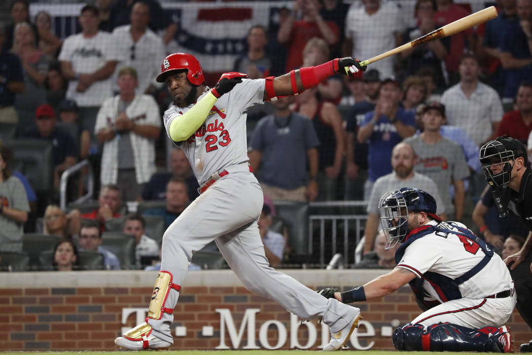 St. Louis Cardinals left fielder Marcell Ozuna (23) hits a two RBI double against the Atlanta B ...