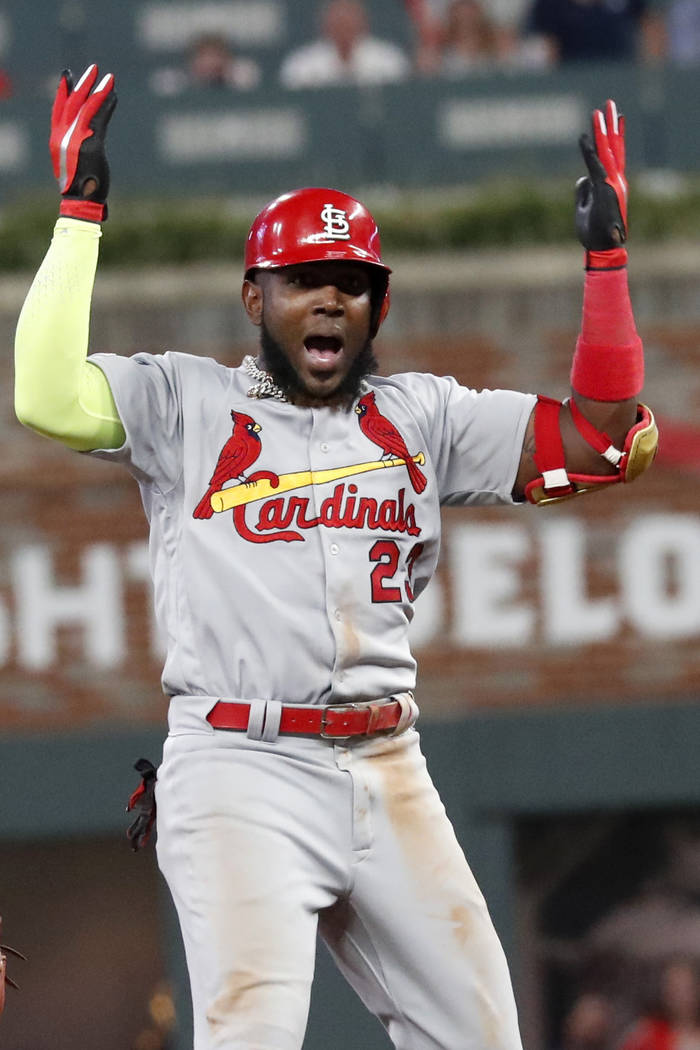 St. Louis Cardinals left fielder Marcell Ozuna (23) celebrates his two RBI single against the A ...