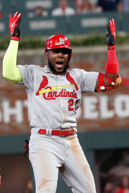 St. Louis Cardinals left fielder Marcell Ozuna (23) celebrates his two RBI single against the A ...