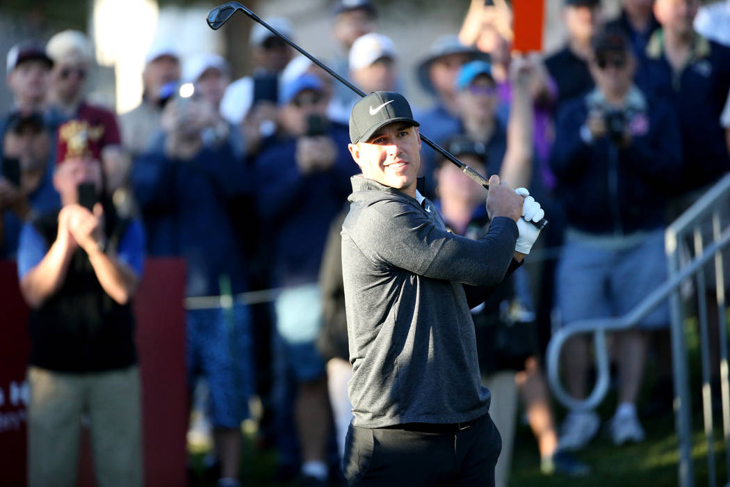 Brooks Koepka watches his tee shot on the 10th hole during Shriners Hospitals for Children Open ...