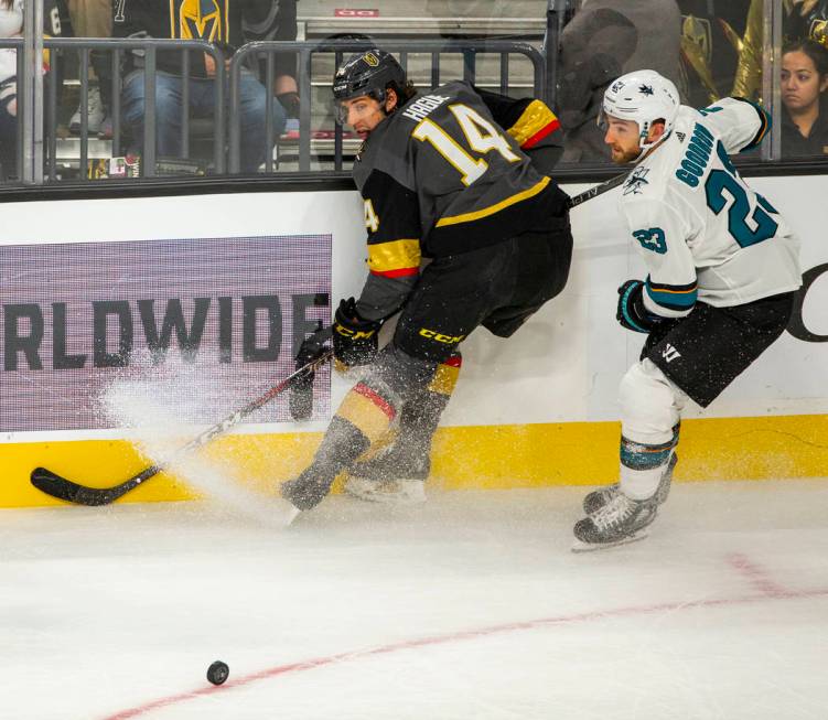 Vegas Golden Knights defenseman Nicolas Hague (14) skates to a stop beside San Jose Sharks righ ...