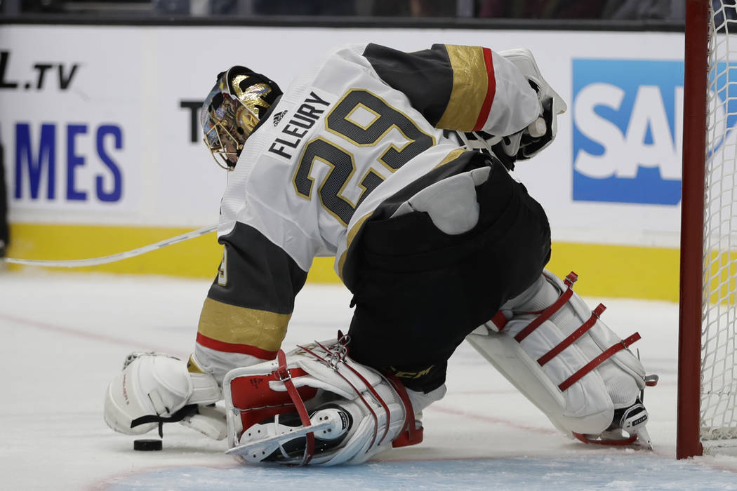 Vegas Golden Knights goalie Marc-Andre Fleury stops a shot from the San Jose Sharks during the ...