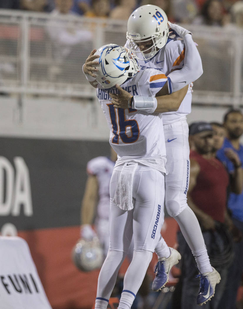 Boise State Broncos wide receiver John Hightower (16) celebrates with Boise State Broncos quart ...