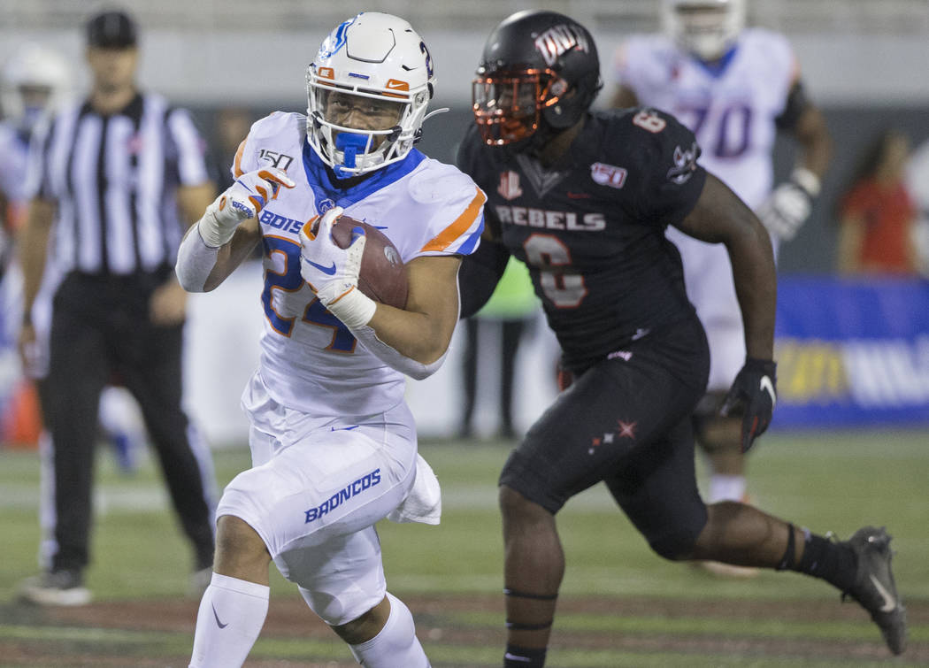 Boise State Broncos running back George Holani (24) breaks a big run past UNLV Rebels defensive ...