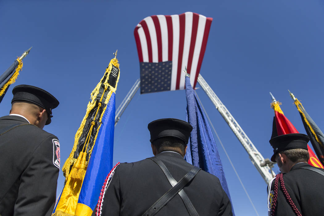 Henderson Fire and Police Department personnel march in a procession honoring Henderson Fire De ...