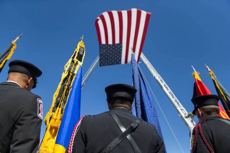 Henderson Fire and Police Department personnel march in a procession honoring Henderson Fire De ...