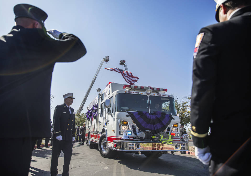 Henderson Fire and Police Department personnel march in a procession honoring Henderson Fire De ...