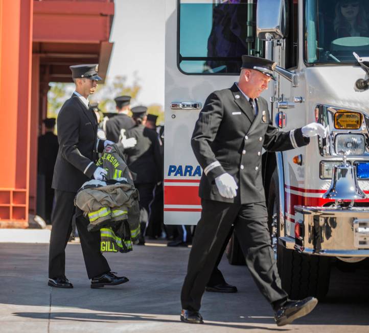 The gear of deceased Henderson Fire Department firefighter/paramedic Robbie James Pettingill is ...