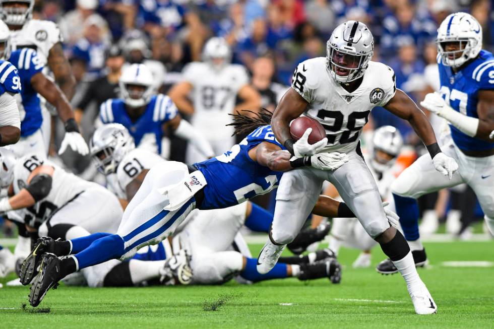 Indianapolis Colts strong safety Clayton Geathers (26) tackles Oakland Raiders running back Jos ...