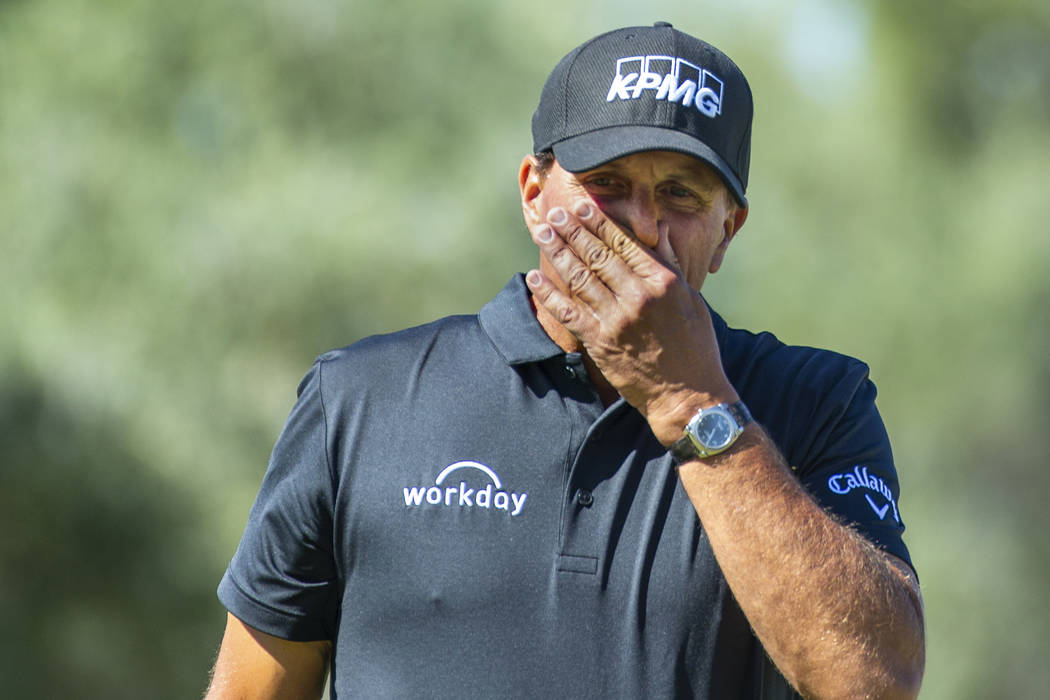 Phil Mickelson reacts to a putt on hole 1 during the third round of Shriners Hospitals for Chil ...