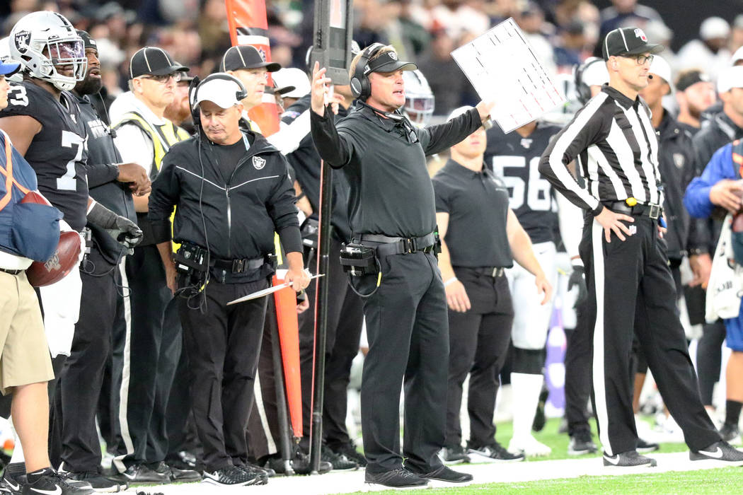 Oakland Raiders head coach Jon Gruden reacts after the referees overturn an interception by cor ...