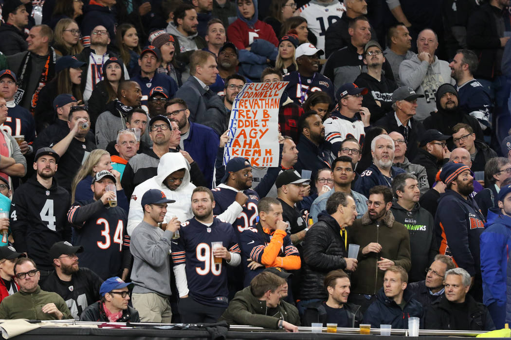 A Chicago Bears fan holds up a sign an NFL game against the Oakland Raiders at Tottenham Hotspu ...