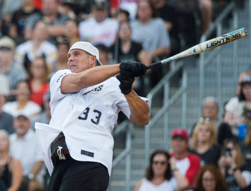 Former Major League Baseball player Jose Canseco takes a swing during the Battle For Vegas Char ...