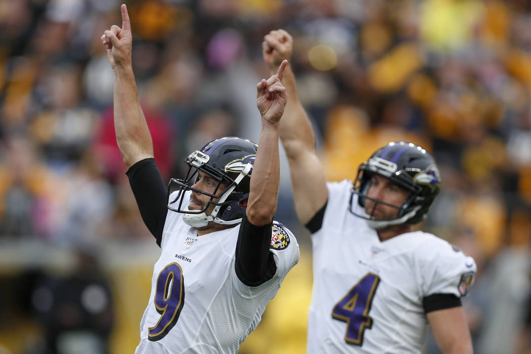 Baltimore Ravens kicker Justin Tucker (9) and Sam Koch (4) celebrate after Tucker made a field ...