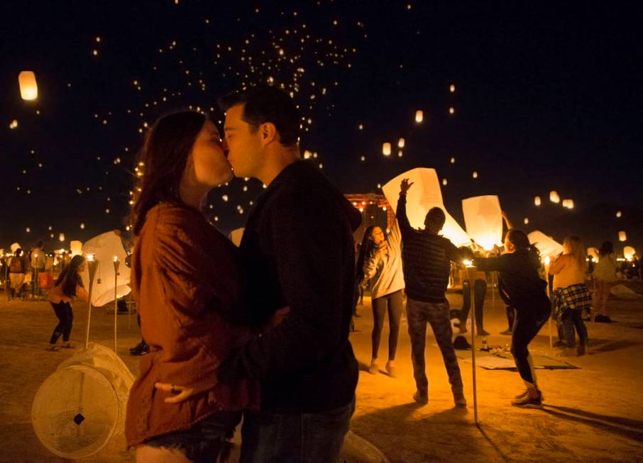 Amanda and Michael Alerich from Los Angeles kiss during the RiSE festival on Sunday, Oct. 6, 20 ...