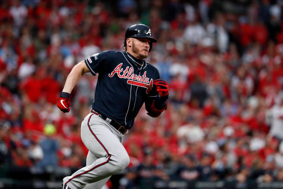 Atlanta Braves' Josh Donaldson runs after hitting a single during the ninth inning in Game 3 of ...