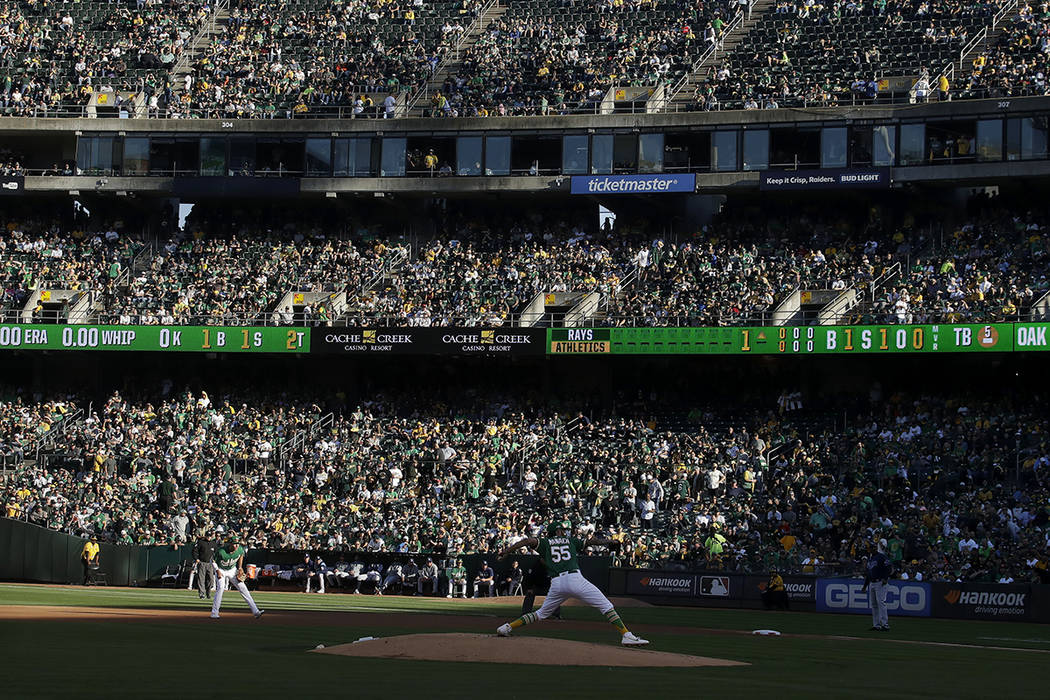 Fans at RingCentral Coliseum watch as Oakland Athletics pitcher Sean Manaea (55) throws to a Ta ...