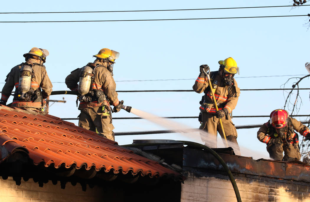 Clark County and Las Vegas firefighters battle a fire in a commercial area at 824 E. Sahara Ave ...