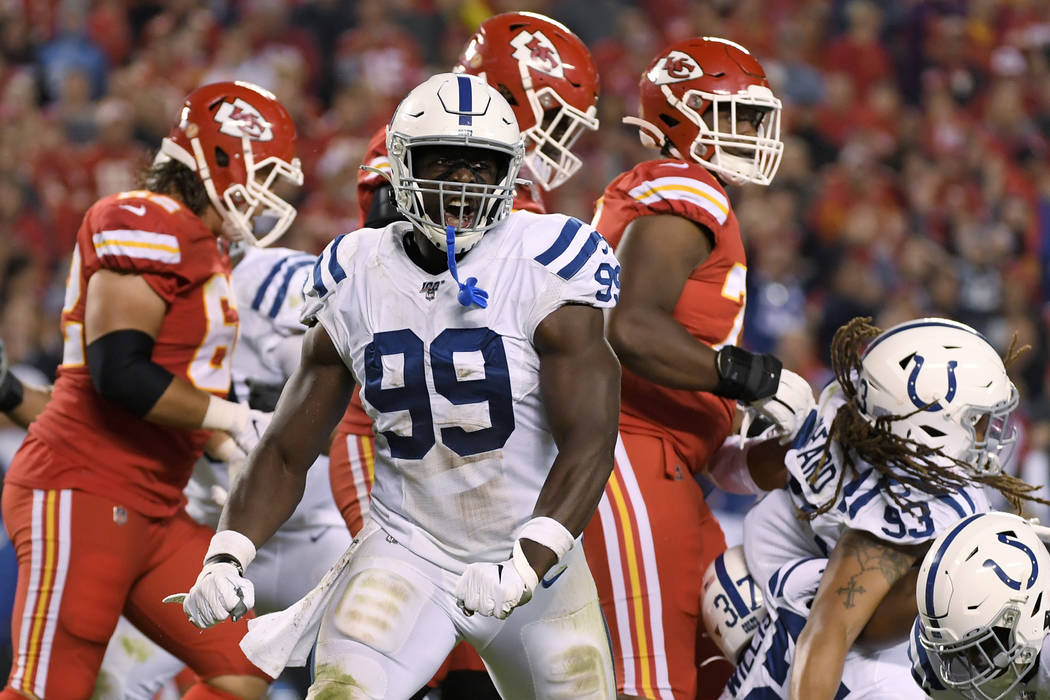 Indianapolis Colts defensive end Justin Houston (99) reacts after tackling Kansas City Chiefs r ...