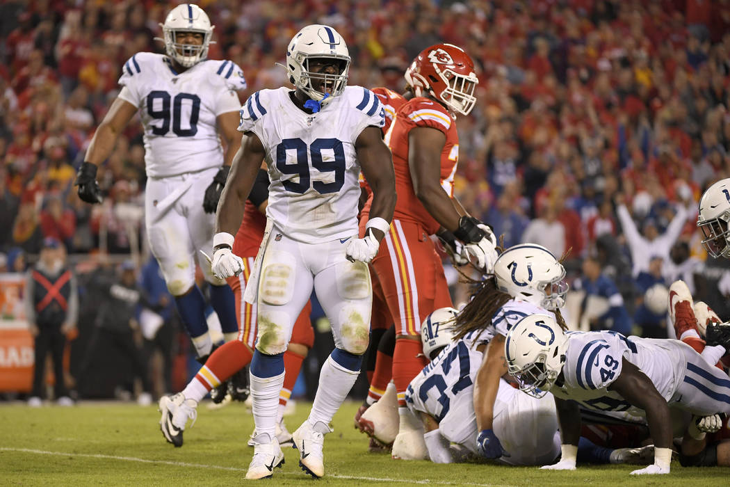 Indianapolis Colts defensive end Justin Houston (99) reacts after tackling Kansas City Chiefs r ...