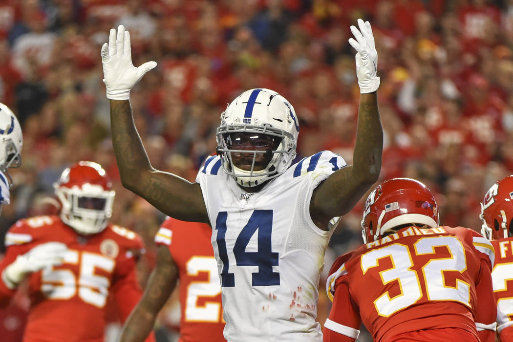 Indianapolis Colts wide receiver Zach Pascal (14) signals a touchdown during the first half of ...