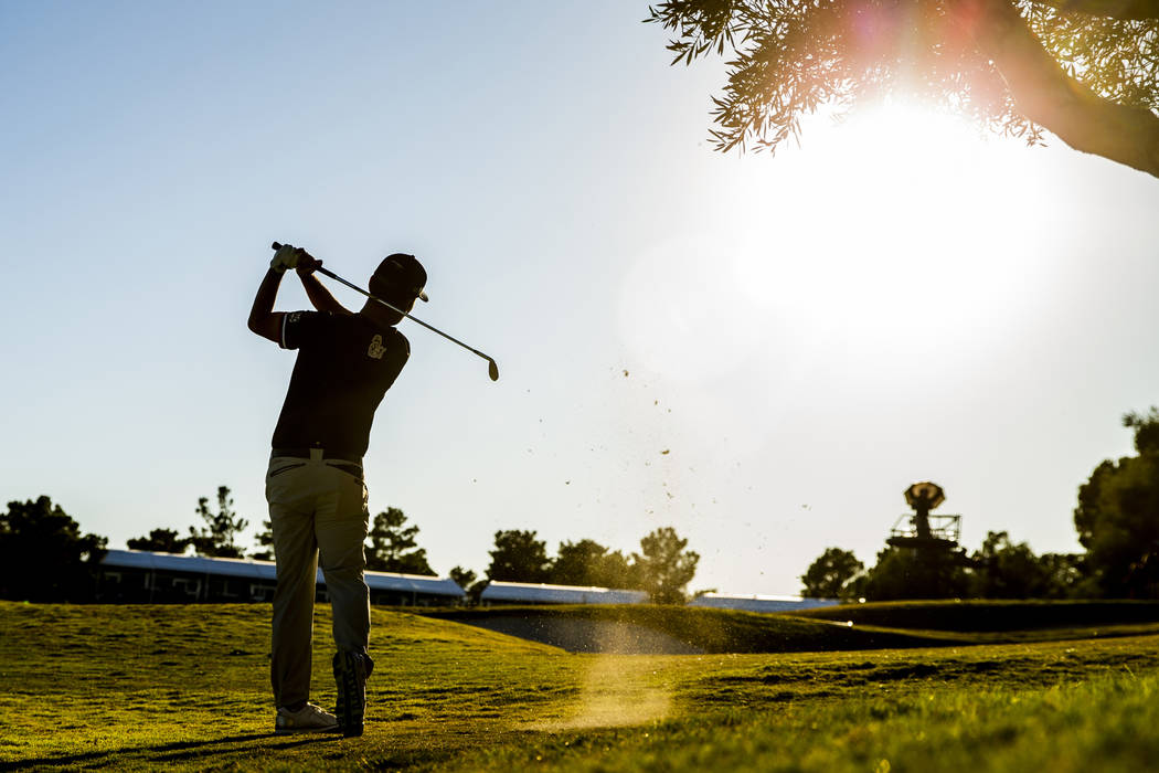 Kevin Na hits onto the green at hole 18 during the final round of Shriners Hospitals for Childr ...