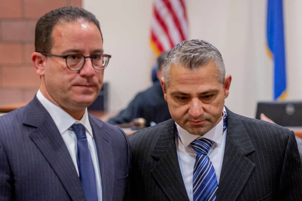 Defense attorney Richard Schonfeld, left, walks with Michel Rantissi Jr., 46, a physical therap ...