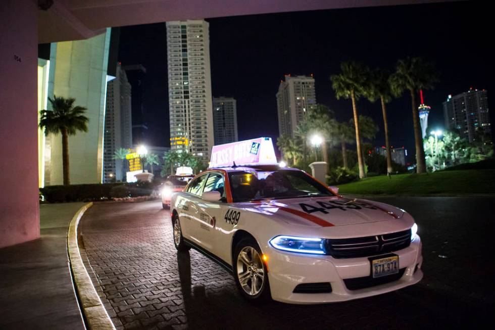 Desert Cab taxi driver Andrew Gnatovich lines up to pick up passengers at the Westgate in Las V ...