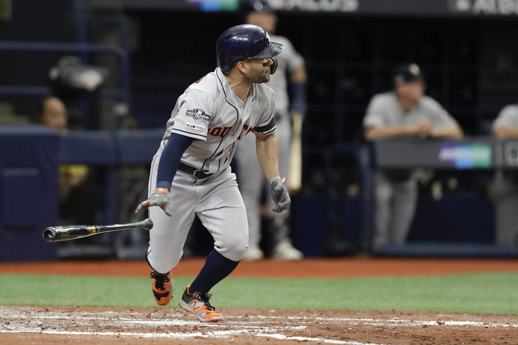 Houston Astros' Jose Altuve hits a double against the Tampa Bay Rays during the third inning of ...