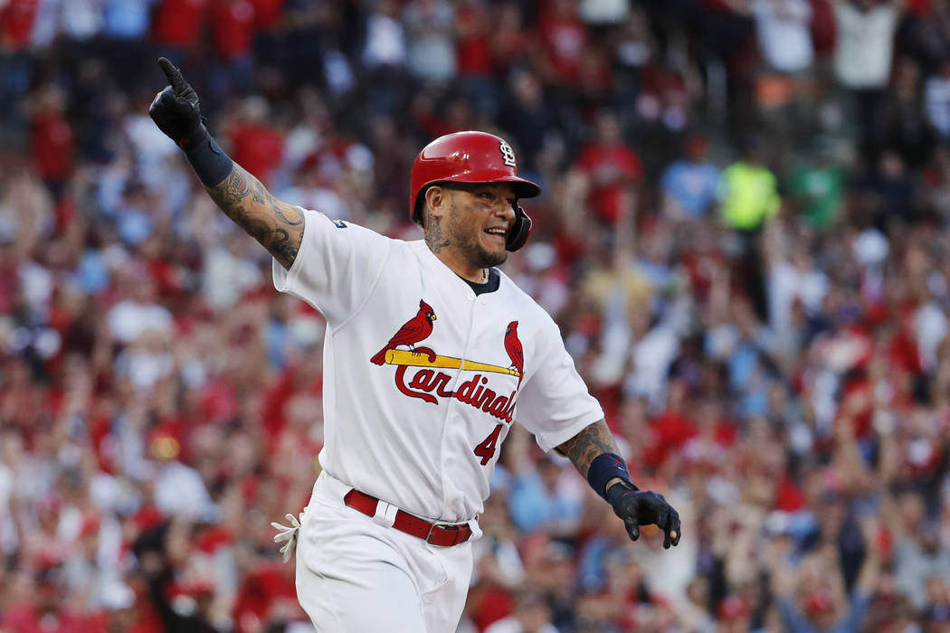 St. Louis Cardinals' Yadier Molina reacts after hitting an RBI-single during the eighth inning ...