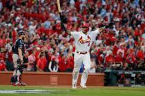 St. Louis Cardinals' Yadier Molina celebrates after hitting a sacrifice fly to score Kolten Won ...