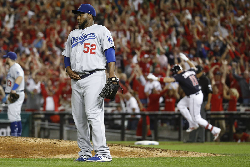 Los Angeles Dodgers relief pitcher Pedro Baez (52) looks away after giving up a three-run homer ...