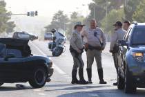 Las Vegas police investigate a serious injury crash at East Harmon Avenue and South Sandhill Ro ...