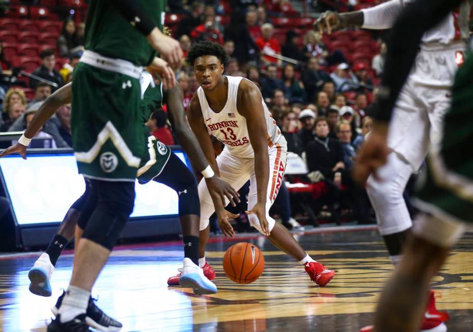 UNLV Rebels guard Bryce Hamilton (13) brings the ball up court against Colorado State during th ...