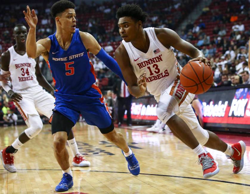 UNLV Rebels guard Bryce Hamilton (13) drives to the basket against Boise State Broncos guard Ma ...